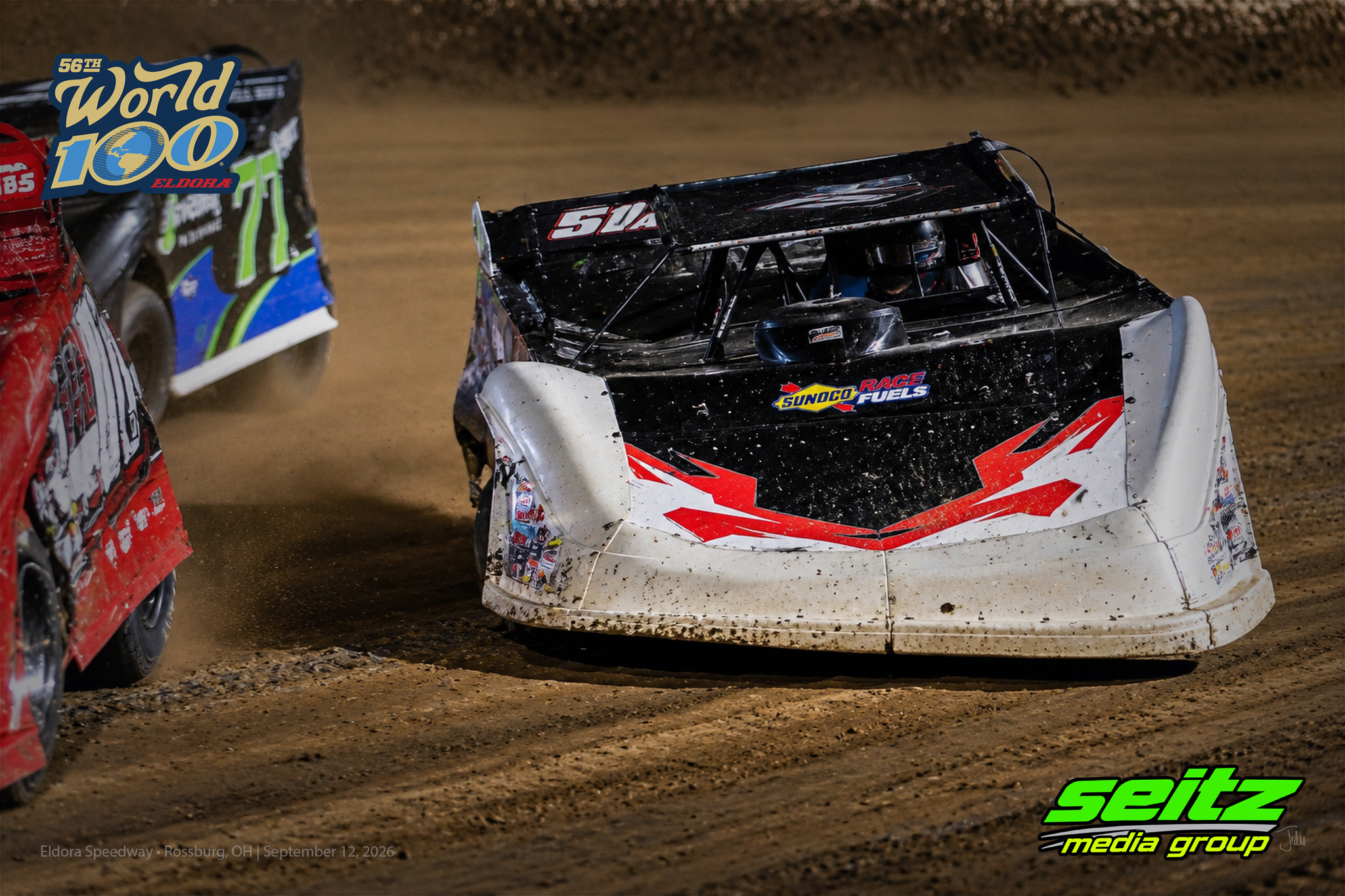 Dirt track race cars in action