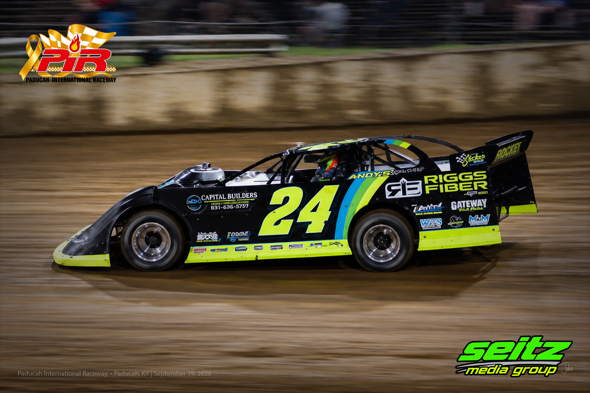 Dirt track race cars in action