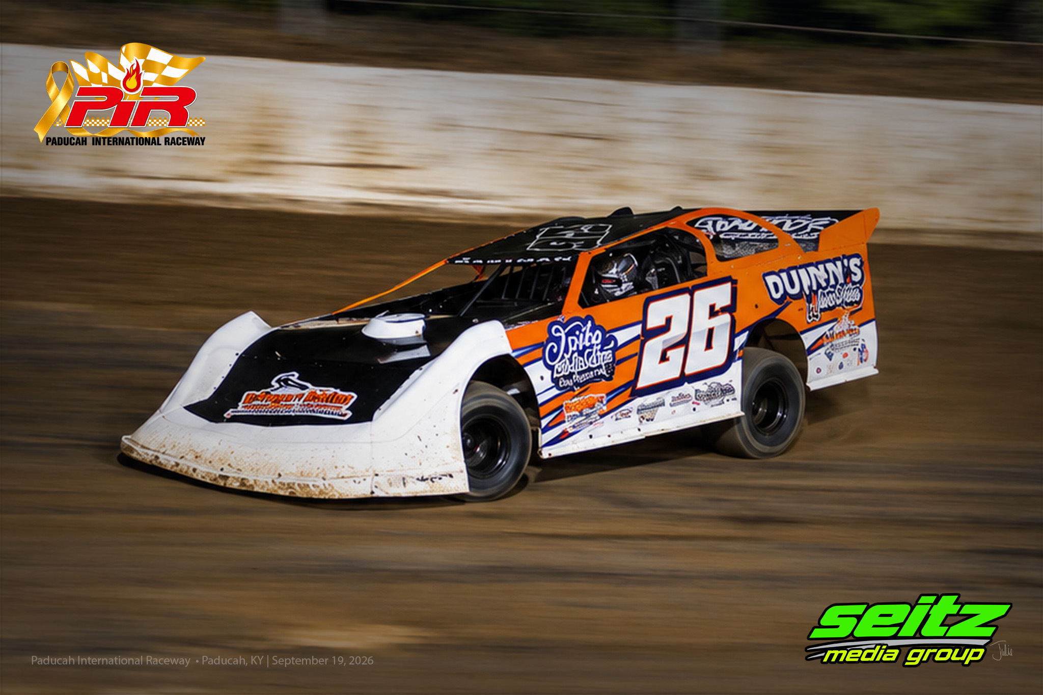 Dirt track race cars in action