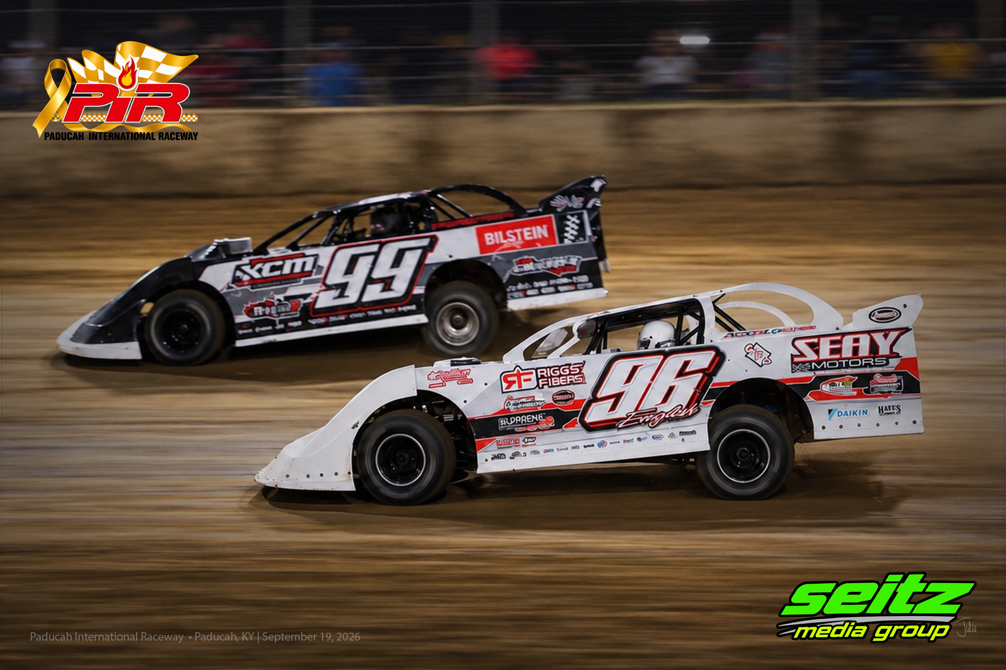 Dirt track race cars in action